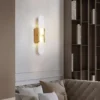 مصباح جداري LED بيضاوي الشكل بلمسة نهائية ذهبية عصرية ولوحة رخامية بيضاوية الشكل مع قاعدة رخامية